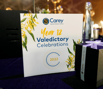Carey Year 12 Valedictory Celebrations 2022 card on a gala table